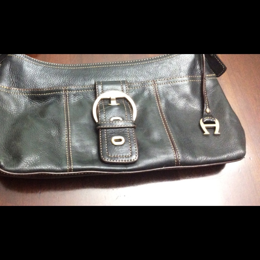 Black leather Etienne Aigner purse. Excellent condition
